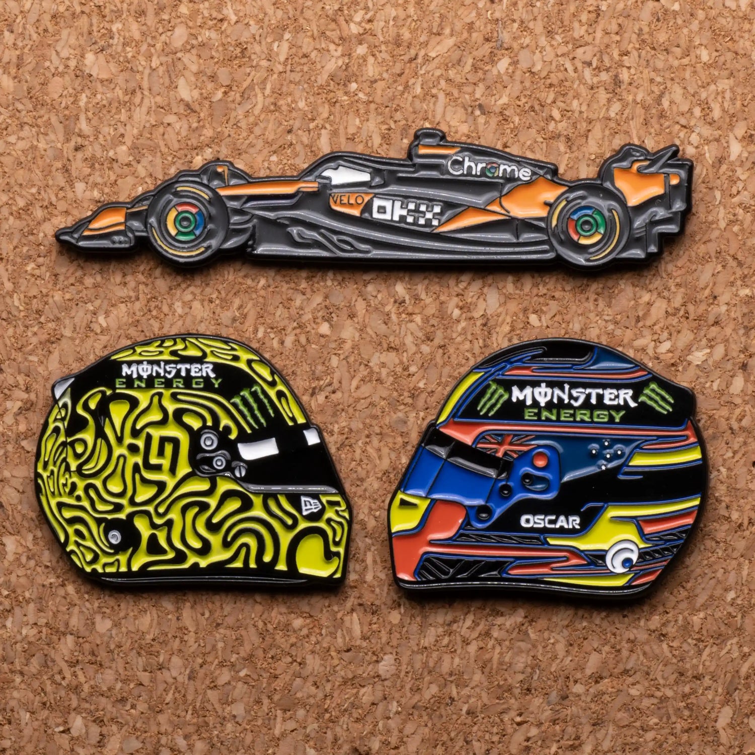 2025 McLaren Enamel Pin Bundle shown on pin board