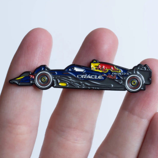 Red Bull RB21 Formula One Car Enamel Pin shown on hand