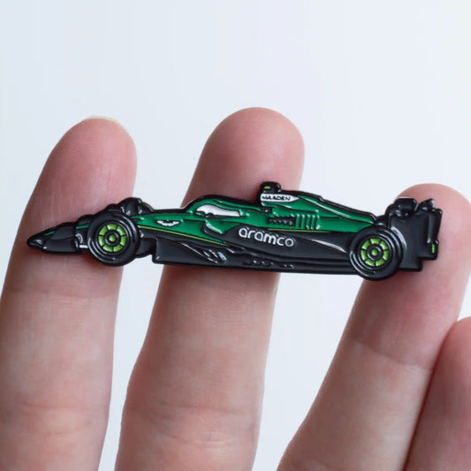 Aston Martin AMR25 Formula One Car Enamel Pin shown on hand