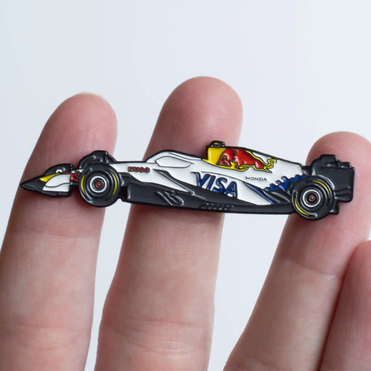 Racing Bulls VCARB 02 Formula One Car Enamel Pin shown on hand