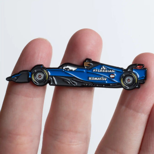 Williams FW47 Formula One Car Enamel Pin shown on hand
