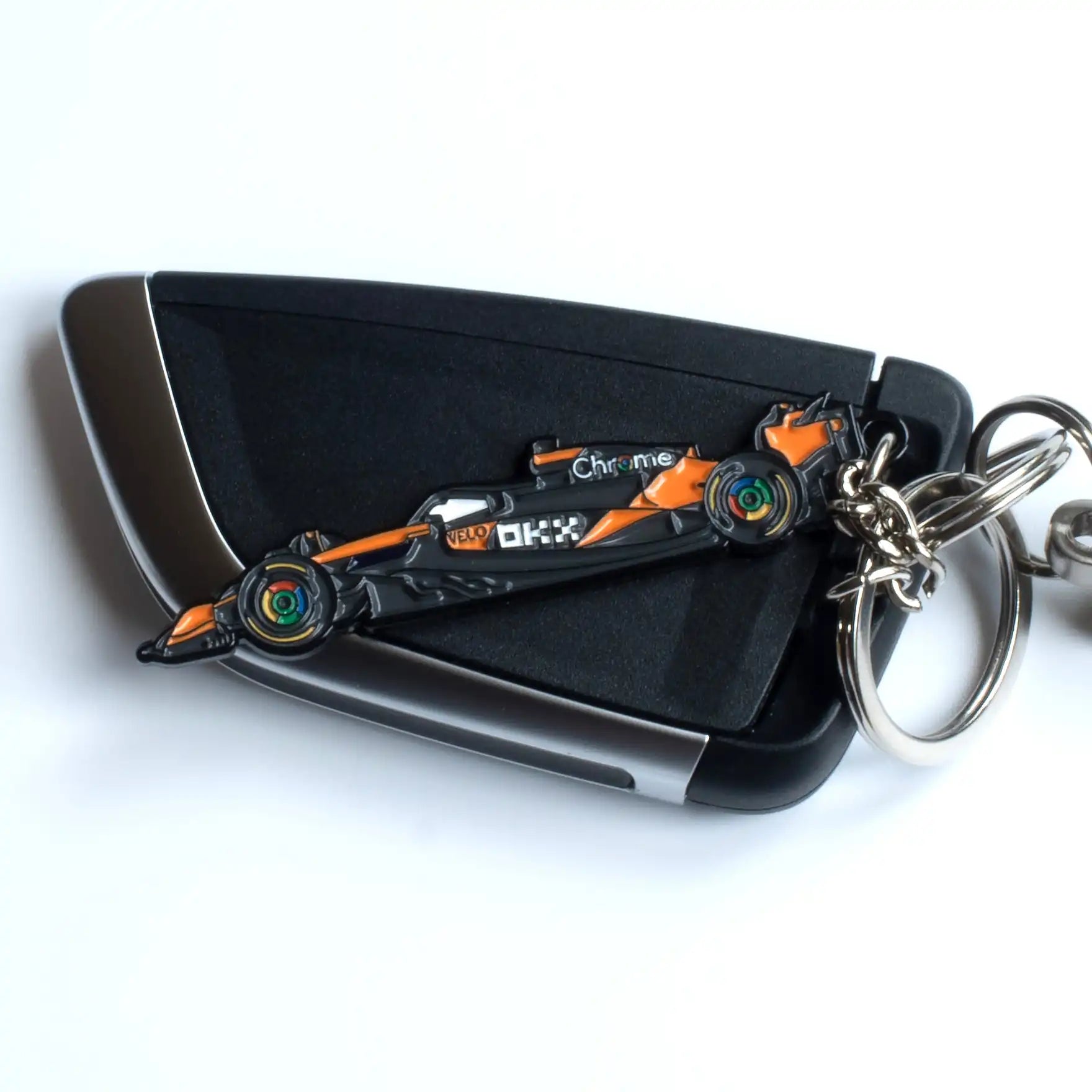 McLaren MCL39 Formula One Car Enamel Keychain shown on key fob