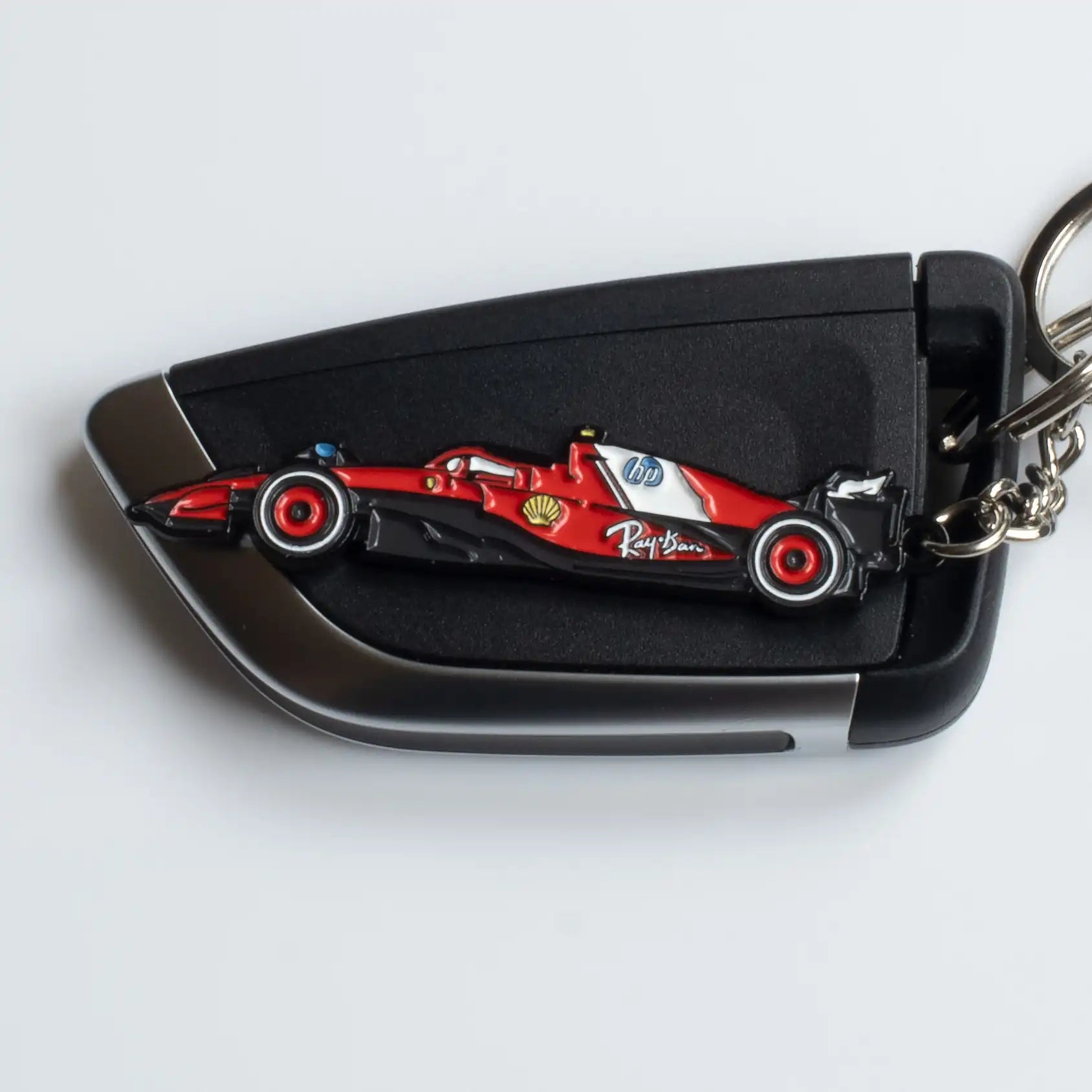 Ferrari SF-25 Formula One Car Enamel Keychain shown on key fob