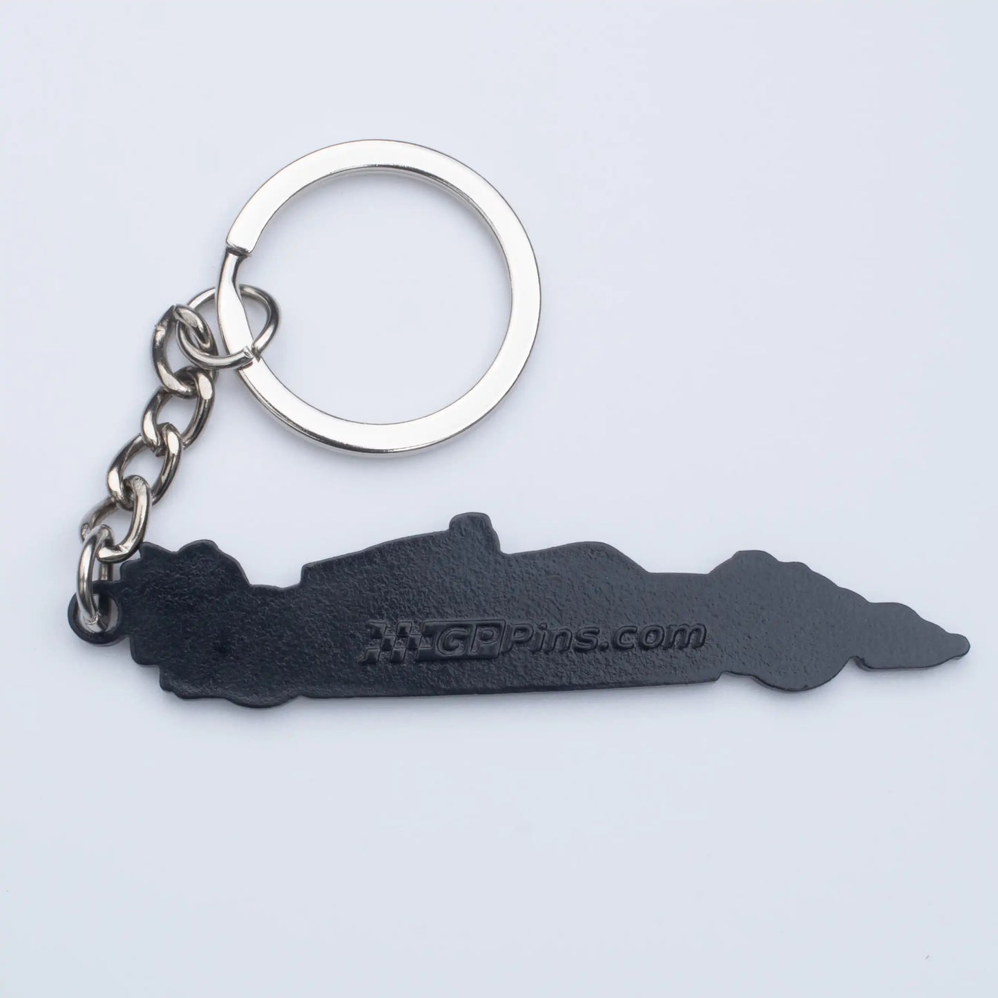 Back of McLaren MCL39 Formula One Car Enamel Keychain shown on white background