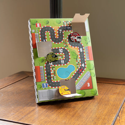 F1 Enamel Pin 12 Door Advent Calendar front showing some pins in the doors