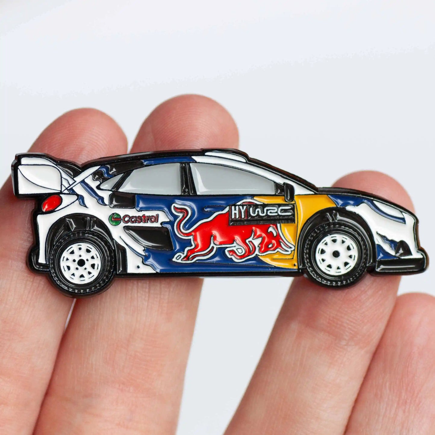 Ford Puma 2024 Rally1 Car Enamel Pin shown on hand