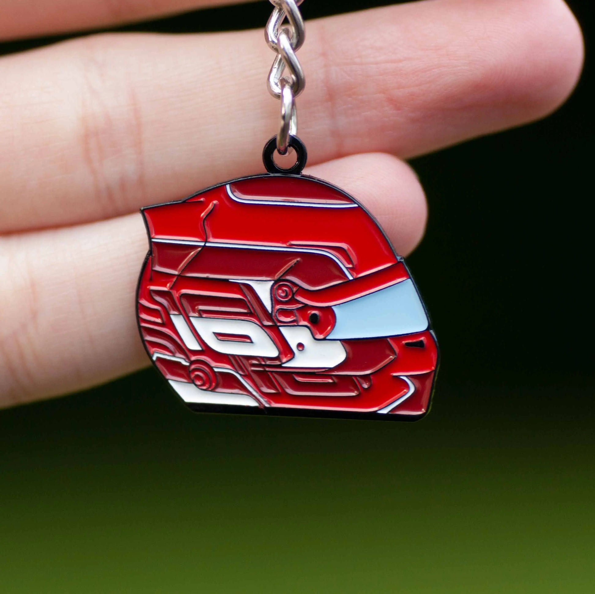 Charles Leclerc 2024 Helmet Enamel Keychain shown on hand