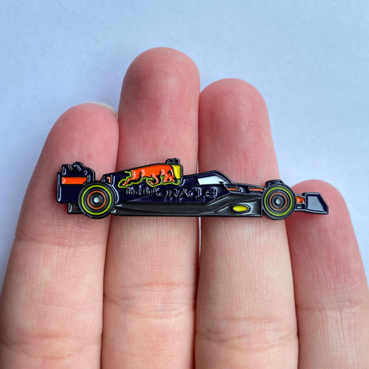 Red Bull RB18 Formula One Enamel Pin shown on hand